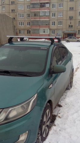 Багажник LUX на аэродинамических дугах для  Kia Rio седан (2011-2017)