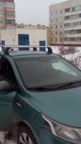 Багажник LUX на аэродинамических дугах для  Kia Rio седан (2011-2017)